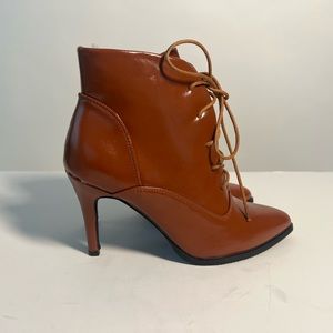 Cute lace up booties with stiletto heel on cognac tint